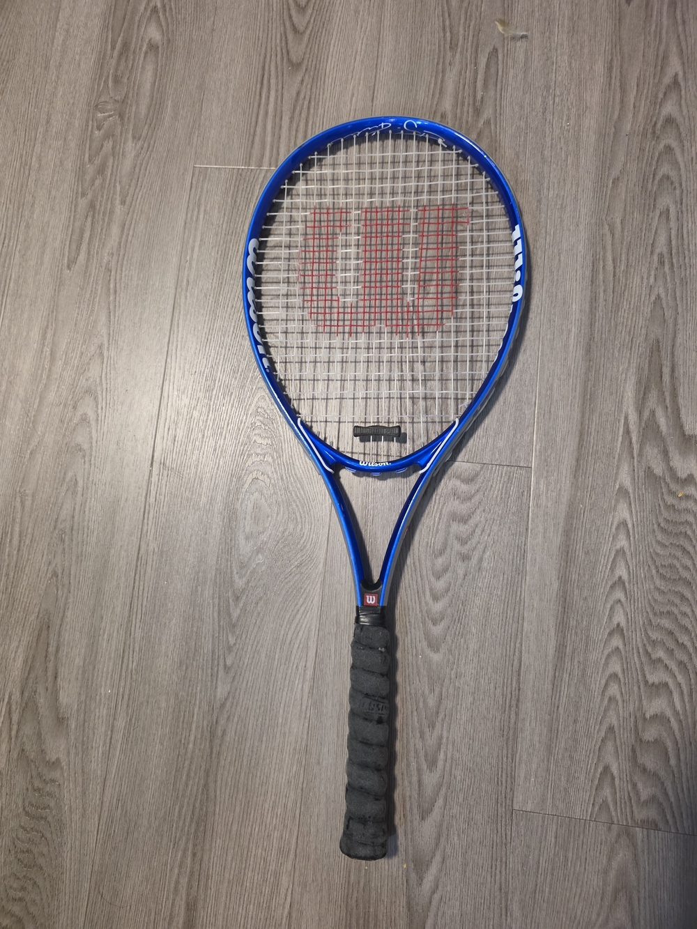 Wilson blue and black tennis racket